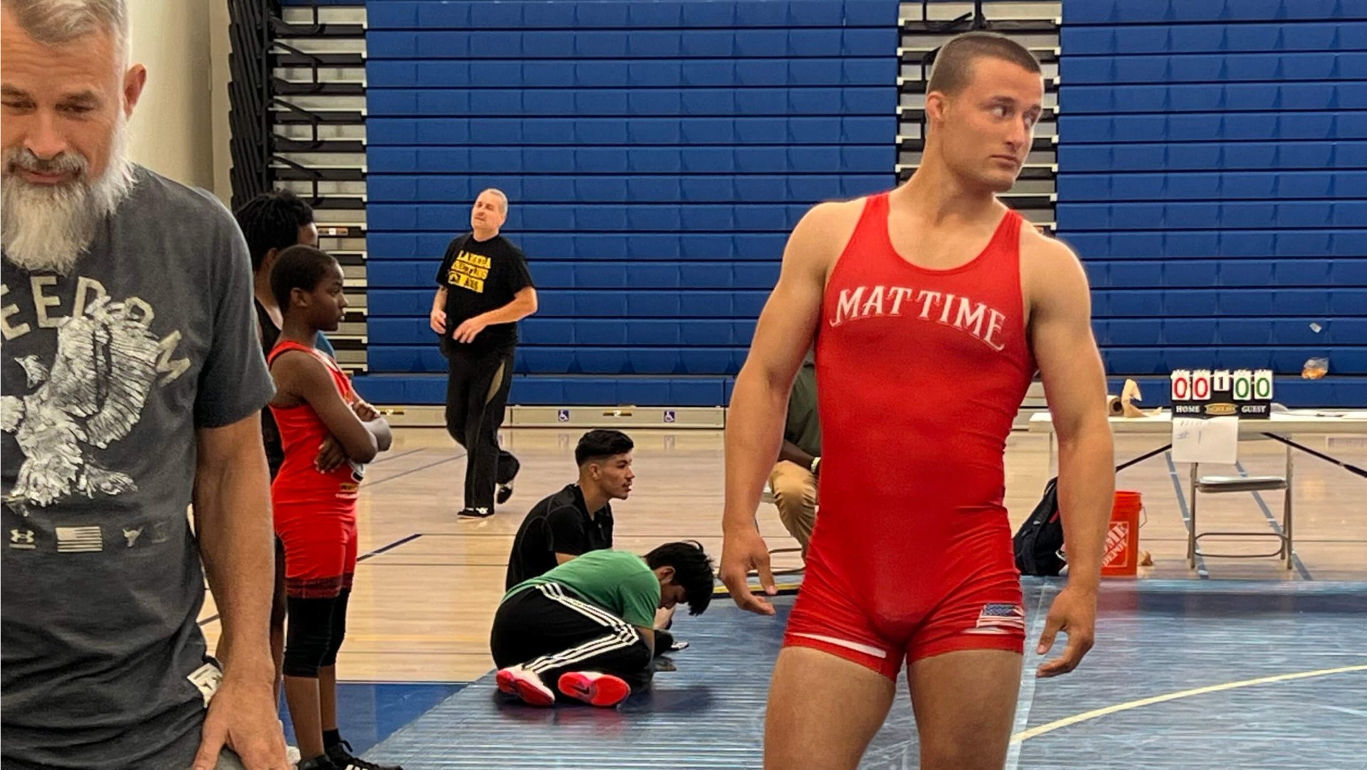 Evan Ivaldi wrestling in a MatTime singlet