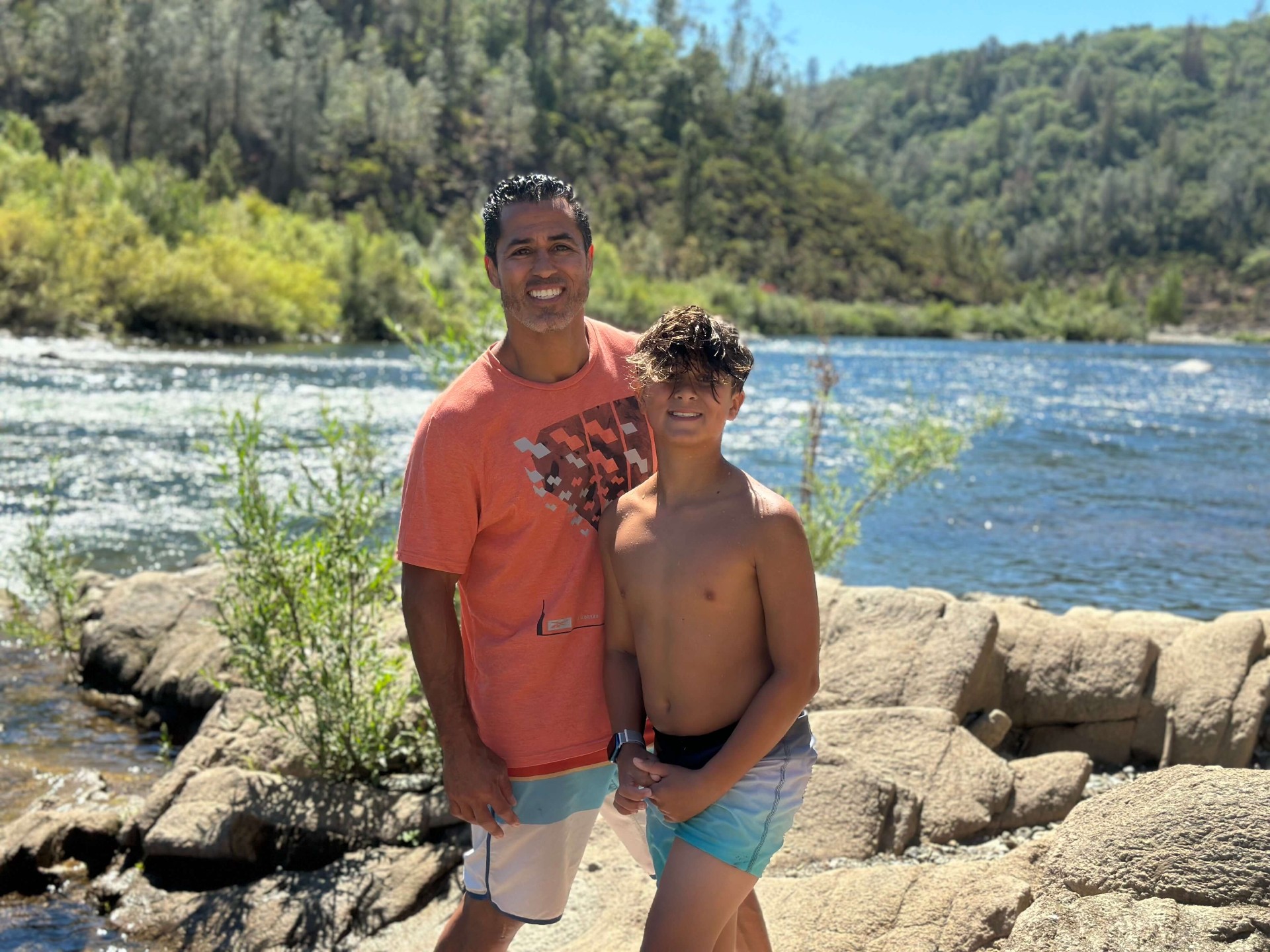 Coach Adrian Garcia with his son Cruz at the American River