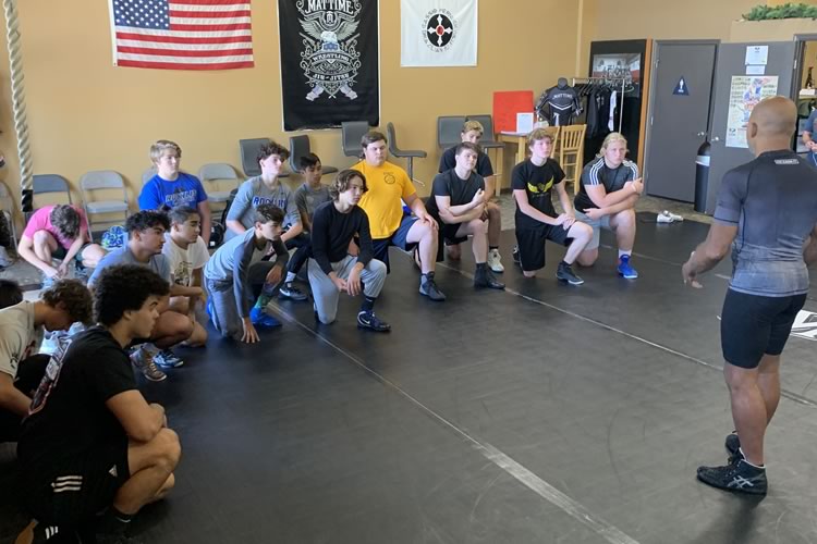 Lee Kemp gives a speech to his wrestling class